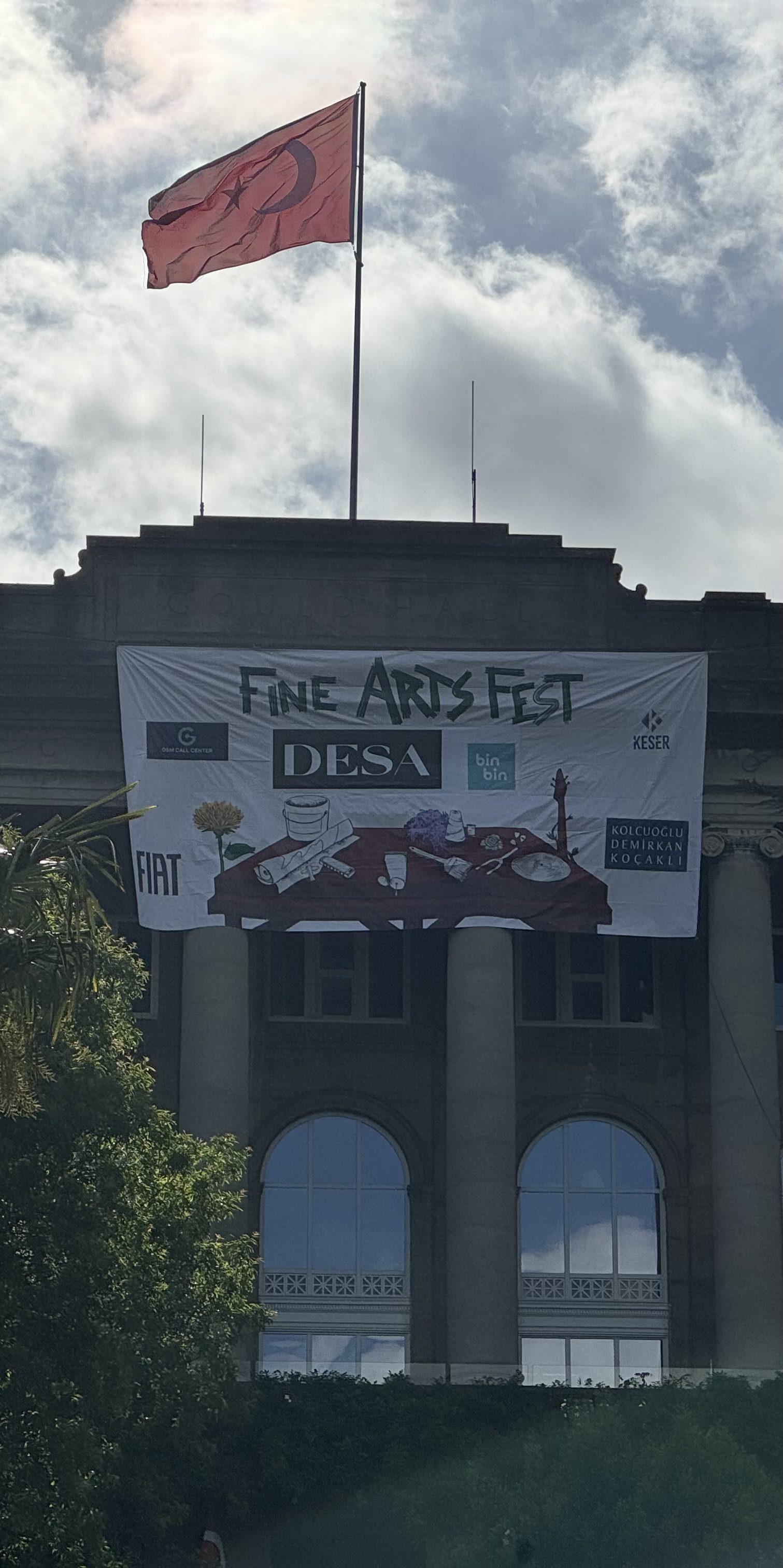 The Fine Arts Fest banner hung across the school façade with sponsor logos
