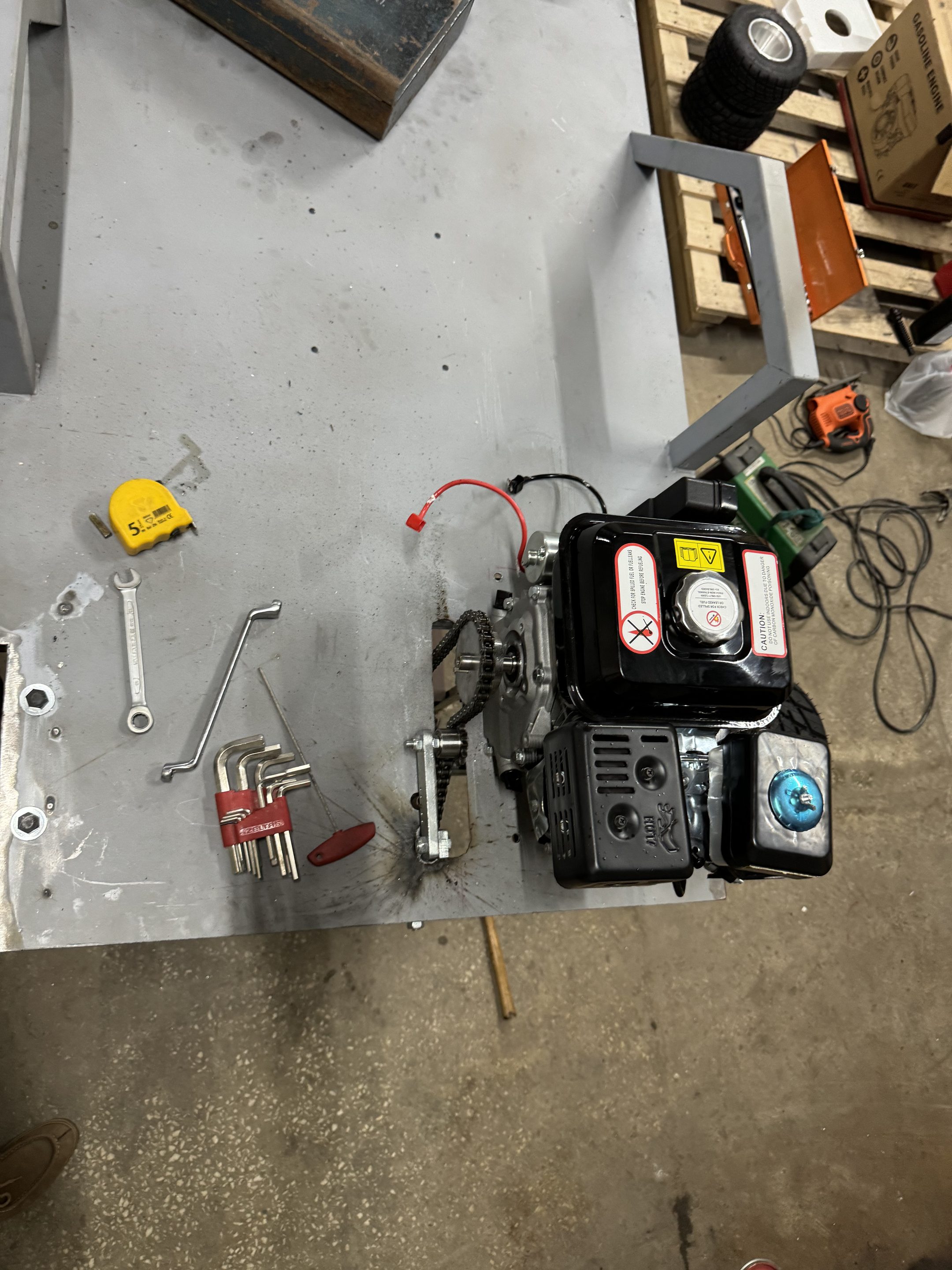 Engine and chain drive mounted on the deck